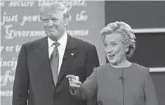  ?? ROBERT DEUTSCH, USA TODAY ?? Hillary Clinton and Donald Trump appear on stage during the first presidenti­al debate Monday at Hofstra University.
