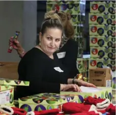  ?? ANDREW FRANCIS WALLACE/TORONTO STAR ?? Longtime Ontario Disability Support Program caseworker Mary Maarouf volunteers for the Santa Claus Fund for the second time.