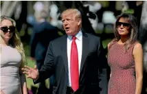  ?? PHOTO: AP ?? President Donald Trump stops to speak to members of the media as he arrives for Easter services with daughter Tiffany Trump, left, and First Lady Melania Trump, right, at Episcopal Church of Bethesda-by-the-sea in Palm Beach, Florida.