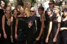  ?? ?? Karl Lagerfeld with models in Paris, July 1996. Photograph: Daniel Simon/GammaRapho/Getty Images