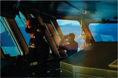  ?? ?? Naval officers on their watch inside the bridge of the BRP Davao Del Sur as they sail the West Philippine Sea on May 18, 2023. photo