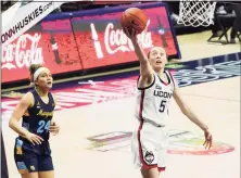  ?? David Butler II / USA Today ?? UConn’s Paige Bueckers (5) drives to the basket against Marquette on Monday night.