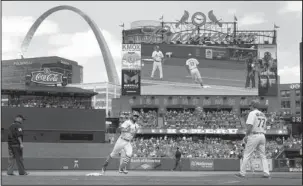  ?? The Associated Press ?? ROUNDING THIRD: St. Louis Cardinals’ Matt Carpenter (13) rounds the bases after hitting a two-run home run as third base coach Chris Maloney (77) watches during the fifth inning of a baseball game against the San Francisco Giants Sunday in St. Louis.