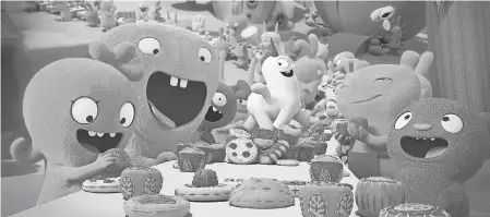  ?? STX ENTERTAINM­ENT ?? Moxy (pink, voiced by Kelly Clarkson), Babo (gray, voiced by Gabriel Iglesias) and Lucky Bat (red, voiced by Leehom Wang) enjoy a well-balanced meal of cookies and cake.
