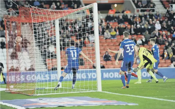  ?? ?? Luke O’Nien, hidden, scores the opening goal in the win over Ipswich Town.