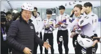  ?? HA SA-HUN/YONHAP VIA AP ?? South Korean President Moon Jae-in, left, meets with South Korean national short track skaters Wednesday during a visit to Jincheon National Training Center in Jincheon, South Korea.