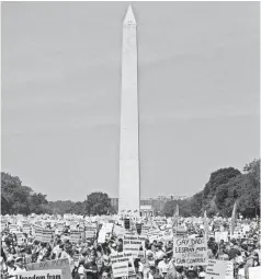  ?? KAMENKO PAJIC/AP ?? About threequart­ers of a million people crowd the National Mall in Washington for the Million Mom March on Mother’s Day in 2000.