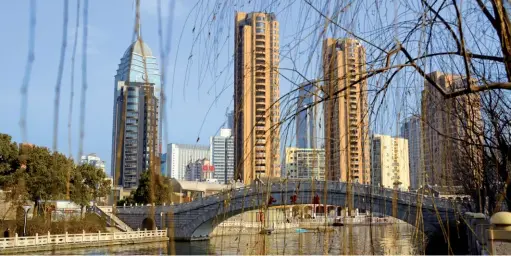  ??  ?? Above: Wuxi’s modern skyline grows along the ancient Grand Canal