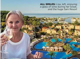  ??  ?? ALL SMILES: Lisa, left, enjoying a glass of wine during her break, and the huge Sani Resort