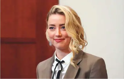  ?? Photos by AP ?? Amber Heard arrives into the courtroom after a break at the Fairfax County Circuit Courthouse in Fairfax, Virginia, Monday, May 23, 2022.