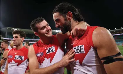  ?? Photograph: Cameron Spencer/Getty Images ?? Logan McDonald celebrates with Brodie Grundy after Swans’s win over the Melbourne Demons at the SCG on AFL opening night.