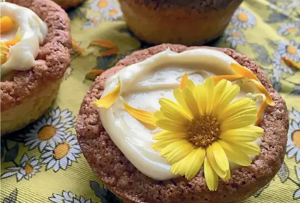  ??  ?? Calendula and orange baby cakes with honey cream icing are as pretty as a picture and taste as sweet.