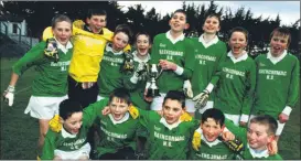  ?? ?? The Rathcormac National School team celebrate their win at the Sciath na Scól finals held at Páirc Uí Rinn in 2001.