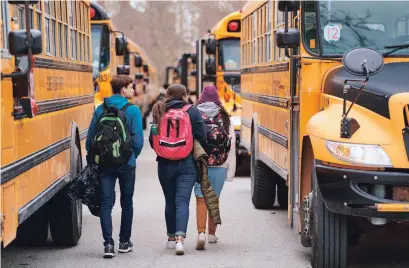  ?? GEOFF ROBINS AFP/GETTY FILE PHOTO ?? Students leave Beal Secondary School in London, Ont., on March 13, before a three-week break to slow the spread of COVID-19.