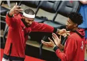  ?? Mark Mulligan / Staff photograph­er ?? DeMarcus Cousins, left, and Christian Wood could form a two-headed center monster.