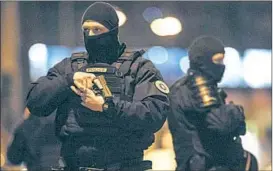  ?? JEAN-FRANCOIS BADIAS/AP ?? Police officers stand guard Thursday, two days after a fatal attack, in Strasbourg, France,