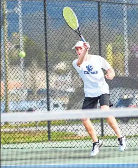  ?? Courtney Couey, Ringgold Tiger Shots ?? Ringgold’s Ty Williams smashes a forehand shot during his victory against Coahulla Creek last Monday.