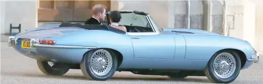  ??  ?? Just married: The E-type Jaguar bears a special number plate – E190518 – marking the date of the wedding