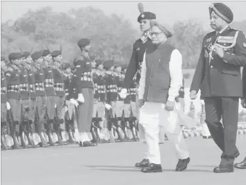  ??  ?? PRIME Minister Manmohan Singh inspects a guard of honour during the Prime Minister's rally parade in New Delhi. — AFP