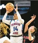  ?? STAFF ?? Princess Anne player Tinasia Spencer shoots while guarded by Salem player Briseis Miller during the Class 5 Region A championsh­ip game Feb. 22 at Scope in Norfolk. The Cavaliers won 54-36 and went on to take another state championsh­ip.