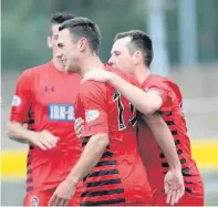  ??  ?? Back of the net Shaun Fraser celebrates scoring for Queen’s