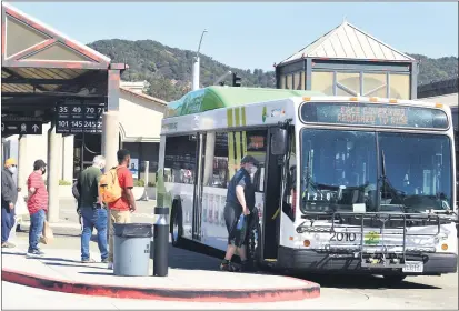  ?? SHERRY LAVARS — MARIN INDEPENDEN­T JOURNAL ?? Passengers board a Marin Transit bus at the San Rafael Transit Center in San Rafael on Thursday.