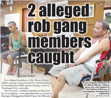  ?? BERNARDO BATUIGAS ?? Two alleged members of the Waray-Waray robbery gang are interrogat­ed at
the National Bureau of Investigat­ion headquarte­rs

       
  