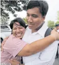  ?? PORNPROM SATRABHAYA ?? Patnaree Charnkij and her son Sirawith ‘Ja New’ Seritiwat embrace outside the Bangkok Women’s Correction­al Institutio­n after she was freed on bail.