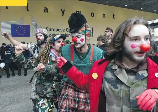  ?? JOHN THYS / AFP / GETTY IMAGES ?? People protest the Comprehens­ive Economic and Trade Agreement between Canada and the European Union at the EU Commission headquarte­rs in Brussels on Thursday. Belgium announced a breakthrou­gh in talks, potentiall­y snapping a deadlock that threatened...