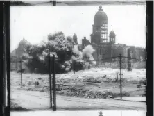  ??  ?? Scenes from the film that surfaced last year at a flea market show a damaged building being blown up with dynamite, above left, with the crumbling City Hall in the background; a scene of crowds along Market Street, above right; people crowding onto a...