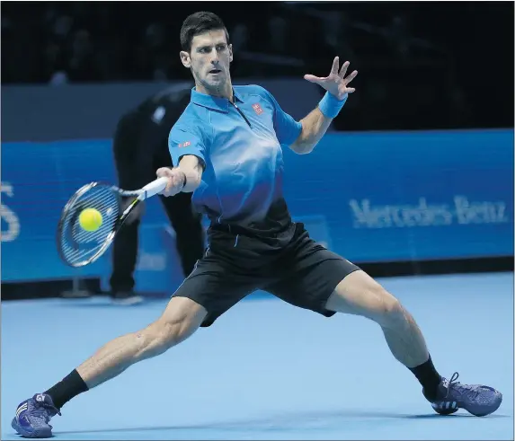  ?? — THE ASSOCIATED PRESS ?? Serbia’s Novak Djokovic stretched his win streak at the season-ending ATP finals to 15 matches on Sunday.