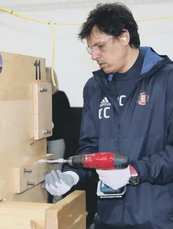  ??  ?? Chris Coleman on Sunderland’s visit to the Caterpilla­r plant in Peterlee.