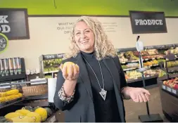  ?? PETER LEE WATERLOO REGION RECORD ?? Krista Hovsepian checks out the produce at Goodness Me! Natural Food Market in Waterloo, the site of her web series, Wholesome Foods, I Love You ... Is that OK?