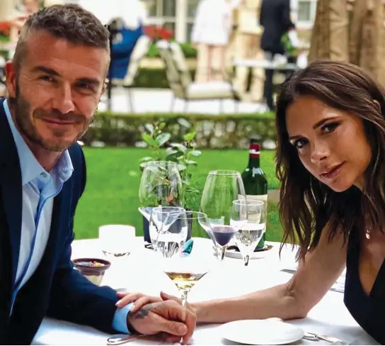  ??  ?? Enduring partnershi­p: David and Victoria Beckham enjoying a romantic dinner on their 19th wedding anniversar­y in July