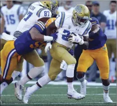  ??  ?? UCLA’s Joshua Kelley (27) rushes against California during the first half of an NCAA college football game on Saturday, in Berkeley. AP PHOTO/BEN MARGOT