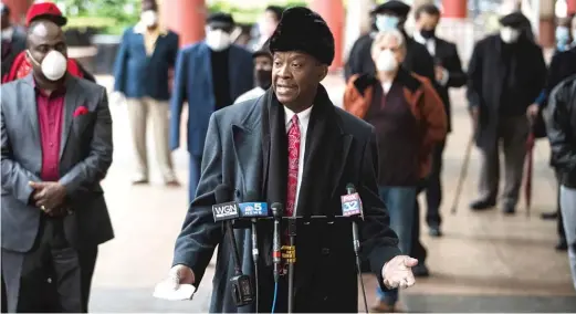  ?? ASHLEE REZIN GARCIA/SUN-TIMES ?? Willie Wilson joins dozens of pastors, religious leaders and their supporters outside the Thompson Center to call on Gov. J.B. Pritzker to allow churches to reopen amid the ongoing coronaviru­s pandemic.