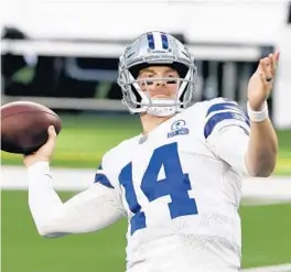  ?? AP PHOTO ?? Cowboys quarterbac­k Andy Dalton warms up before a game in December.