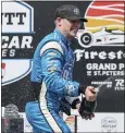  ?? MIKE CARLSON — THE ASSOCIATED PRESS ?? Team Penske driver Josef Newgarden celebrates his victory in the IndyCar opener at St. Petersburg on Sunday.