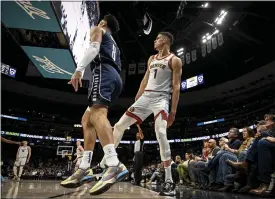  ?? AARON ONTIVEROZ — THE DENVER POST ?? The Nuggets’ Michael Porter Jr., right, watches as he knocks down a three over the Mavericks’ Josh Green on Wednesday at Ball Arena in Denver.