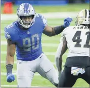  ?? DUANE BURLESON — THE ASSOCIATED PRESS ?? Detroit Lions defensive end Trey Flowers (90) closes in on New Orleans Saints running back Alvin Kamara (41) during the second half of Sunday’s game in Detroit.