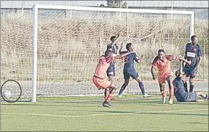  ?? (Pic: Sanele Jele) ?? The goal (ball circled) that broke the hearts of Mbabane Swallows fans, which was scored by Young Buffaloes’ Sandile ‘Saviola’ Gamedze (4th R). The two sides settled for a 1-all draw in an MTN Premier League match played at King Sobhuza II Memorial Stadium.