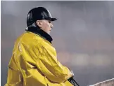  ?? CHARLIE RIEDEL/AP ?? Legendary trainer D. Wayne Lukas watches a horse workout in the rain at Churchill Downs on Tuesday in Louisville, Ky.