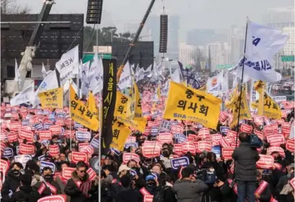  ?? AP PHOTO ?? NO TO MEDICAL POLICY
Senior South Korean doctors stage a rally against the government’s medical policy in Seoul, South Korea, on Sunday, March 3, 2024.