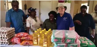  ?? ?? Alan Calder McNicoll with Gweru Rotarians and staff with provisions donated to Midlands Children’s Home in Gweru