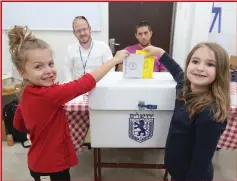  ?? (Marc Israel Sellem/The Jerusalem Post) ?? TWO CHILDREN ‘vote’ at a polling station in Jerusalem yesterday.