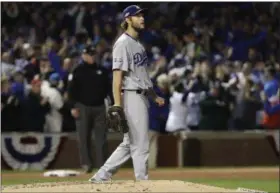  ?? DAVID J. PHILLIP — THE ASSOCIATED PRESS ?? Los Angeles Dodgers starting pitcher Clayton Kershaw (22) watches the ball as Chicago Cubs’ Willson Contreras (40) hits a home run during the fourth inning of Game 6 of the National League baseball championsh­ip series Saturday in Chicago.