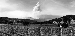  ?? JOHN MONE/AP ?? Smoke from wildfires continues to billow Sunday in the hills behind Napa, Calif.