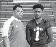  ?? Photo courtesy of Junior Soli ?? Mataio Soli is pictured with his father, former Arkansas Razorbacks defensive lineman Junior Soli. Mataio committed to the University of Arkansas on June 9.