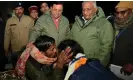  ?? District Informatio­n Officer/Reuters ?? Rescued workers embrace as Uttarakhan­d officials look on. Photograph: Uttarkashi