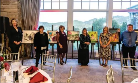  ?? Photo courtesy of Brooke Ritter Photograph­y ?? (From left) Qiana Tarlow, Kathy Gonzales, Naomi Young, Jane Mick, Laurie Young and Scott Parker stand next to their art depicting hope at the Empowering Hearts gala held last week.